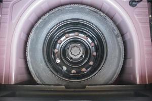 spare tire in the modern compact car photo