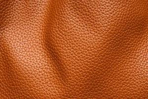 Brown leather texture background close up photo