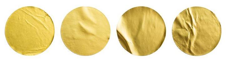 Blank golden round adhesive paper metallic sticker label set isolated on white background photo