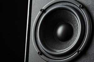 Multimedia speaker system speaker close-up on a black background. photo