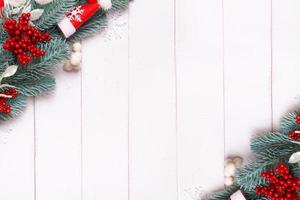 Christmas banner made from pine tree, snowflakes and festive decorations top view. Christmas flat lay photo