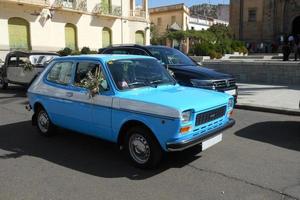 Castuera, Spain -15 October 2022, Model Seat 127, small classic car with wedding ornaments photo