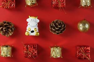 Christmas decorations with a cow on a red background. photo