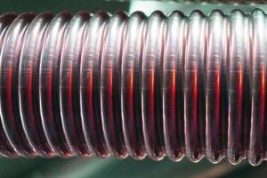 Corrugated metal hose for fuel supply, Close - up. photo