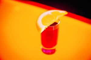 beautifully decorated cocktail in a nightclub, people drink a drink photo