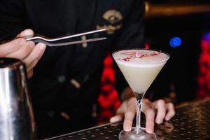 beautifully decorated cocktail in a nightclub, people drink a drink photo