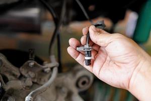 Close up ABS brake sensor of car wheel check for abnormalities to ensure the safety of the brakes service concept photo