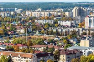 aerial panoramic view from height of a multi-storey residential complex and urban development in autumn day photo