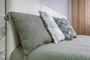 Interior of the modern luxure bedroom in studio apartments in light color style photo