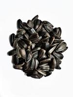 Tasty sunflower seeds isolated on a white background photo