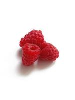 ripe juicy raspberries on a white background photo