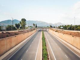 Empty multi-lane highway photographed from the bridge photo