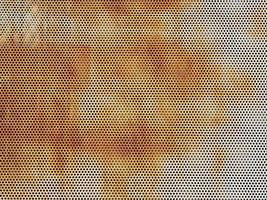 Abstract grunge rusty perforated steel sheet textured background photo