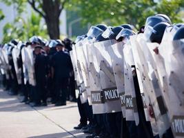 Crowd control police practice using shields and batons. photo