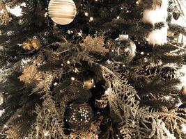 Christmas decorations on the tree. volumetric toys in the form of a ball. glass, voluminous toys hang on the tree. Christmas decoration, stylish decor to create a festive mood photo