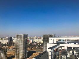 View of the beautiful panorama of the city with the roofs of large tall buildings of buildings of skyscrapers of new buildings photo