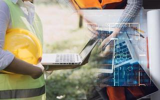 Construction engineer working at blueprint to build large commercial buildings in office. Engineering tools and construction concept. photo