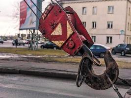 Large black and red metal iron hook for construction crane photo