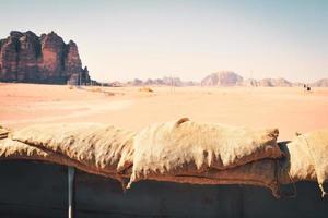 Tourist adventure ride experience Hijaz railway train from 1916. Great arab revolt fighters attack in wadi rum. Popular activities Jordan photo