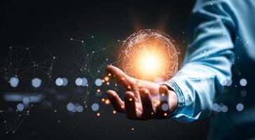 woman Hand holding Light bulb Global Internet connection. Business global internet connection application technology and digital marketing, Financial and banking, Digital link tech, big data. photo