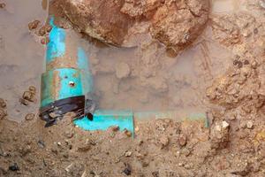 plumbing broken plastic pipe in the hole and water in wait repair photo
