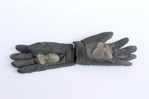 guantes negros viejos y sucios. foto