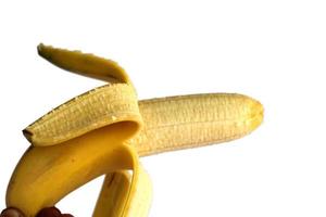 Peeled banana isolated on white background photo