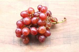 Grapes on a wooden table photo