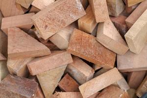 sawn wood cut piled perfectly as backround or use to play as toys. photo