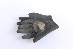 guantes negros viejos y sucios. foto