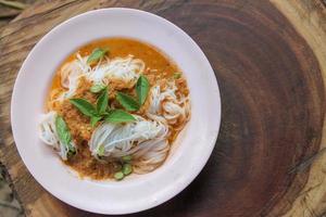 Traditional Thai cuisine, rice vermicelli eaten with green curry. photo