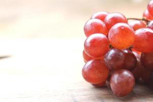 Grapes on a wooden table photo