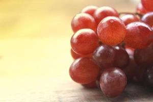 Grapes on a wooden table photo