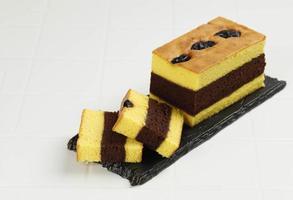 Spiku or Lapis Surabaya, Indonesian Three Layer Cake with with Strawberry Jam Between the Layer. photo