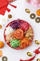 Yee Sang, Yusheng, Lo Hei, or Lou Sang is Cantonese Style Raw Fish Salad. photo