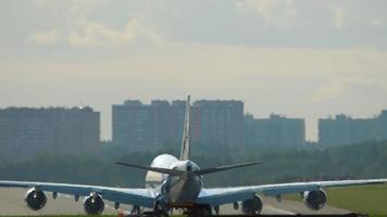 A wide body airliner stands on the runway and is ready to take off video