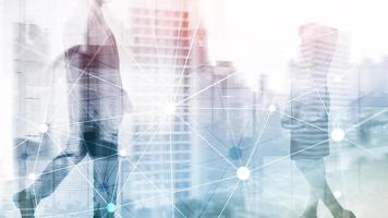 Blockchain network on blurred skyscrapers background. Financial technology and communication concept. photo