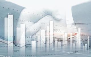 Graph on rows of coins. Financial stock trading graph chart diagram. Exchange and Trading concept. photo