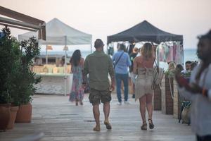 People in Es Pujols in Formentera in the Balearic Islands in Spain in the summer of 2021. photo