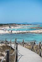 People in the Levante beach in Formentera, Spain in summer 2021. photo