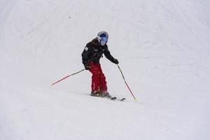Young woman on snowborad in the Pyrenees at the Grandvalira ski resort in Andorra in Covid19 time photo