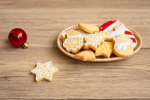 Merry Christmas with homemade cookies on wood table background. Xmas, party, holiday and happy New Year concept photo