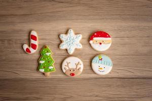 Merry Christmas with homemade cookies on wood table background. Xmas, party, holiday and happy New Year concept photo