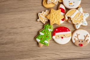 Merry Christmas with homemade cookies on wood table background. Xmas, party, holiday and happy New Year concept photo