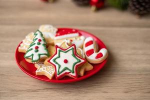 Merry Christmas with homemade cookies on wood table background. Xmas, party, holiday and happy New Year concept photo