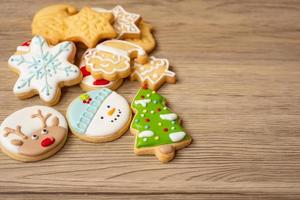 Merry Christmas with homemade cookies on wood table background. Xmas, party, holiday and happy New Year concept photo