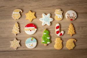 Merry Christmas with homemade cookies on wood table background. Xmas, party, holiday and happy New Year concept photo