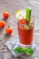 Bloody Mary cocktail on the wooden background photo