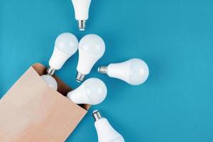 LED light bulbs in craft paper shopping bag photo