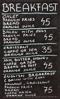 Street cafe breakfast menu written in chalk on a blackboard photo